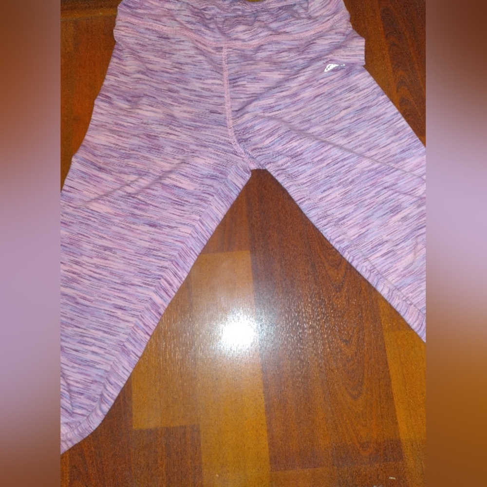 This are purple pants with a little pink and dark purple, the brand is skechers